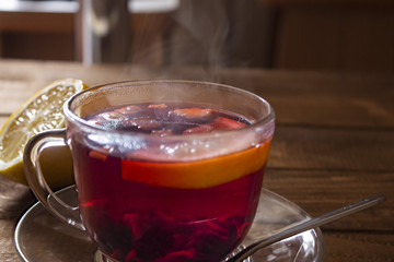 morning brewed in a cup of fruity red tea with lemon