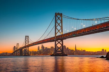 Wall murals Golden Gate Bridge San Francisco skyline with Bay Bridge at sunset, California, USA
