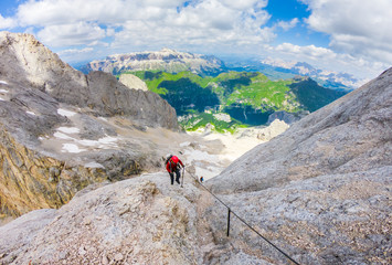  Via ferrata Tofana di Mezzo climbers on the ridge in the Dolomites, Group of climbers on the mountain top, Dolomite Alps, Italy. Silhouette of people climbing the mountain. Tiny Man Big Landscape 