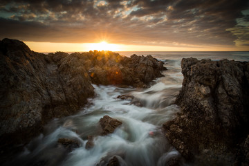 Beautiful sunset over the sandstone cliffs along the coastline of De Kelders in Gansbaai in the Overberg of south africa