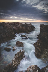 Beautiful sunset over the sandstone cliffs along the coastline of De Kelders in Gansbaai in the Overberg of south africa