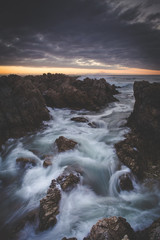 Beautiful sunset over the sandstone cliffs along the coastline of De Kelders in Gansbaai in the Overberg of south africa