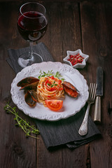 Pasta with mussels and a glass of wine