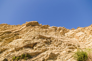 Fototapeta na wymiar Rock naked breed on a cliff, rocks near the sea.