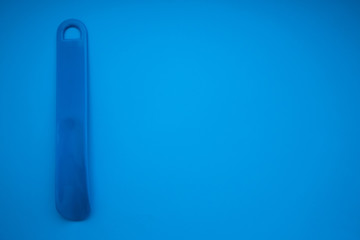 shoehorn on a blue background
