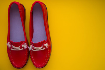 red moccasins on a yellow background