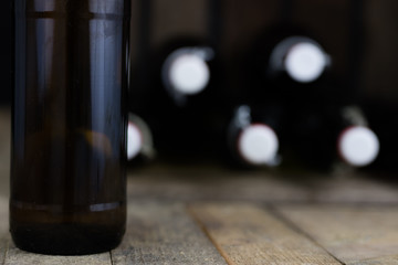 Old bottles in a wooden case. Drinks in old glass containers.