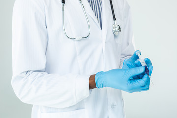 Close up of a syringe in hands of a professional doctor