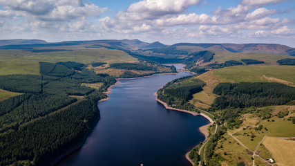 Naklejka na ściany i meble Aerial drone view of a beautiful reservoir in a rural area in summer