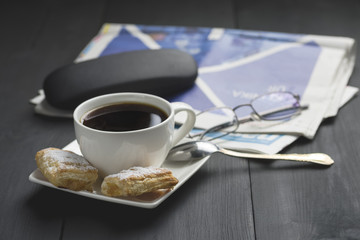 a cup of coffee and something sweet