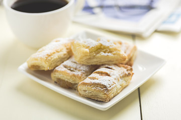 a cup of coffee and something sweet