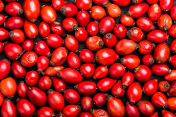 Dried rosehips background, powerful antioxidant with high content of Vitamin. Top view