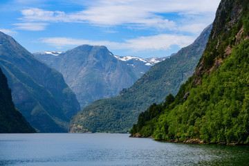 Fototapeta premium Magnificent fjord landscape with a trace from the boat. Neroyfjord offshoot of Sognefjord is the narrowest fjord in Europe. Norway, Europe.