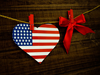 Fototapeta premium Flag of United States of America on heart shape with old vintage paper background, with clipping path - Independence Day
