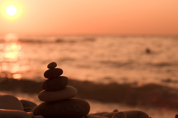 stack of zen stones on pebble beach