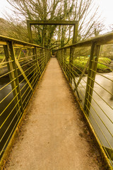 Narrow footbridge over river