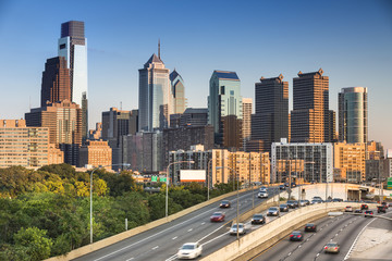 Fototapeta na wymiar Traffic drives on the freeway in downtown Philadelphia Pennsylvania USA