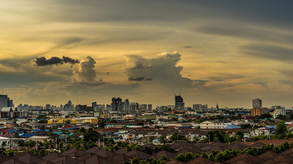 urban and cloudy sky in cityscape at evening time
