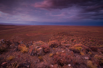 Panoramic views over the Tankwa Karoo Desert with dramatic thunderclouds in the sky