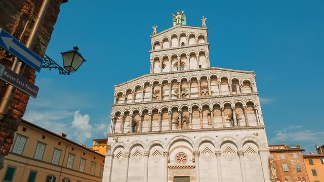 POV shot towards the San Michele in Foro Church in the medieval town of Lucca, Tuscany, Italy. Lucca is famous for its intact city walls dating from the Renaissance era