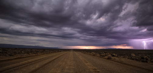 Panoramic views over the Tankwa Karoo Desert with dramatic thunderclouds in the sky