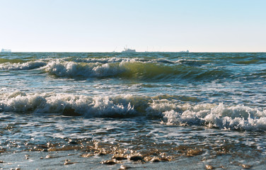 Sea coast. Waves and storms at sea. Waves on the Baltic Sea.