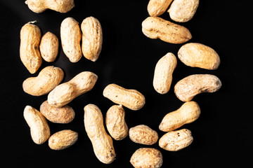 Falling nuts on a black background.