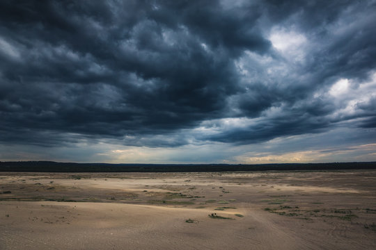 Storm clouds over the Bledowska desert near Chechlo, Malopolskie, Poland