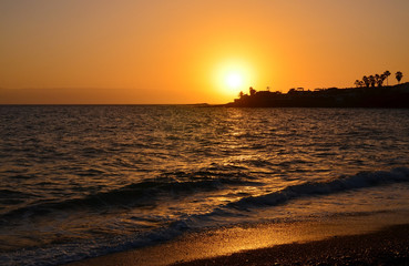 Fototapeta na wymiar Sunset in La Enramada pebble beach in Costa Adeje, Tenerife,Canary Islands,Spain. 