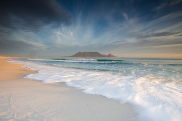 Stunning clouds over Table Mountain in Cape Town South Africa,as seen from blouberg beach, one of the top holiday destinations in the world