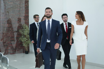 employees standing in a spacious office