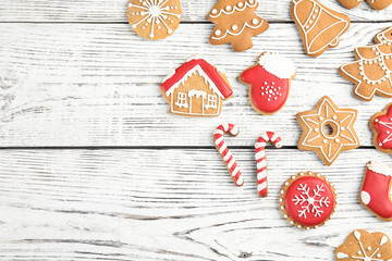 Tasty homemade Christmas cookies on wooden background, top view