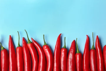 Fotobehang Flat lay composition with chili peppers on color background © New Africa