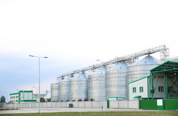 Fototapeta na wymiar Row of modern granaries for storing cereal grains