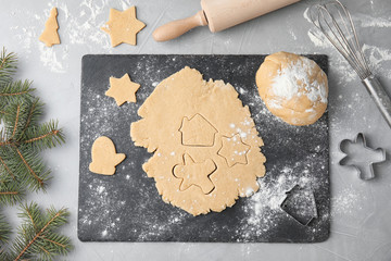 Composition with raw dough for Christmas cookies on table, flat lay