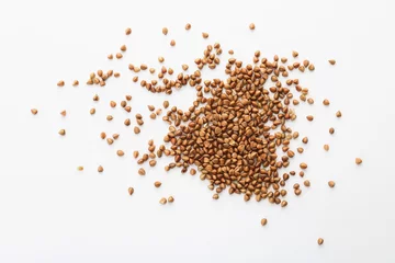 Fotobehang Raw buckwheat on white background. Healthy grains and cereals © New Africa