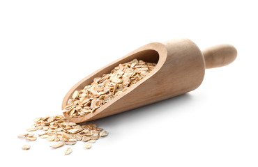 Scoop with raw oatmeal on white background. Healthy grains and cereals