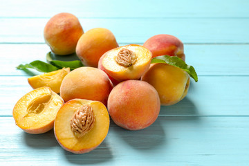 Fresh sweet peaches on wooden table