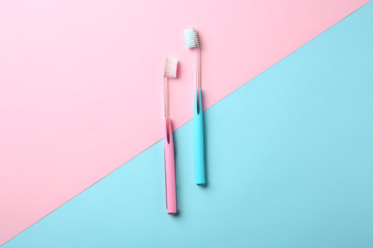 Manual toothbrushes on color background. Dental care