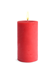 Decorative red wax candle on white background