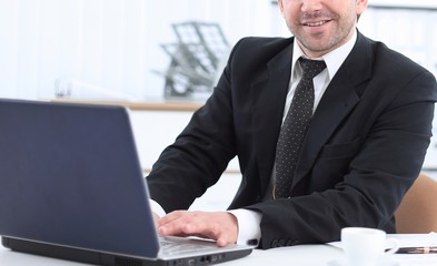 closeup of a senior Manager sitting at Desk