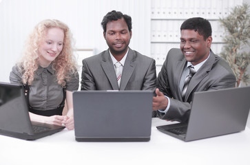 employees sitting on the workplace in the office