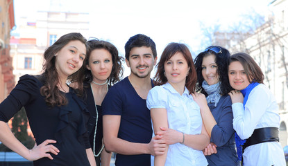 portrait of group of students standing on the street .