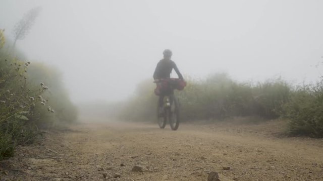 Bike packer down hill 