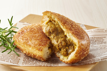 curry bread on wooden plate