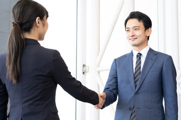 asian business team shaking hands