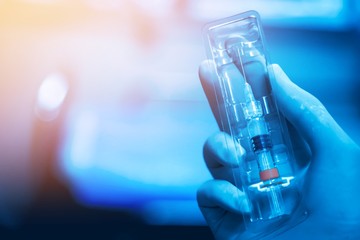 Medical hand gloves dispose medication drug needle syringe drug,concept flu shot vaccine vial dose hypodermic injection treatment disease in hospital,prevention immunization  children.selective focus