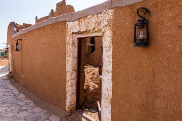 A restored walkway and mudbrick wall downhill from the Munikh Castle, Al Majmaah, Saudi Arabia