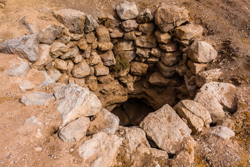A dried-out well in the desert near Abu Jifan Fort, Riyadh Province, Saudi Arabia