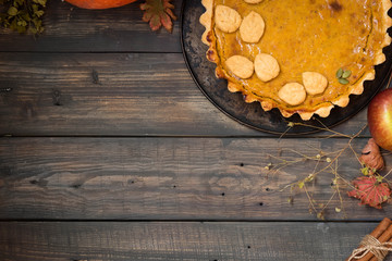 Traditional homemade American pumpkin pie for a holiday. Place for text